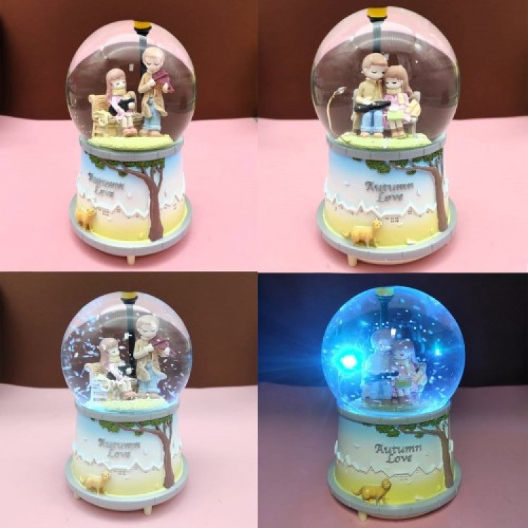 Large Snow Globe Sitting on a Bench
